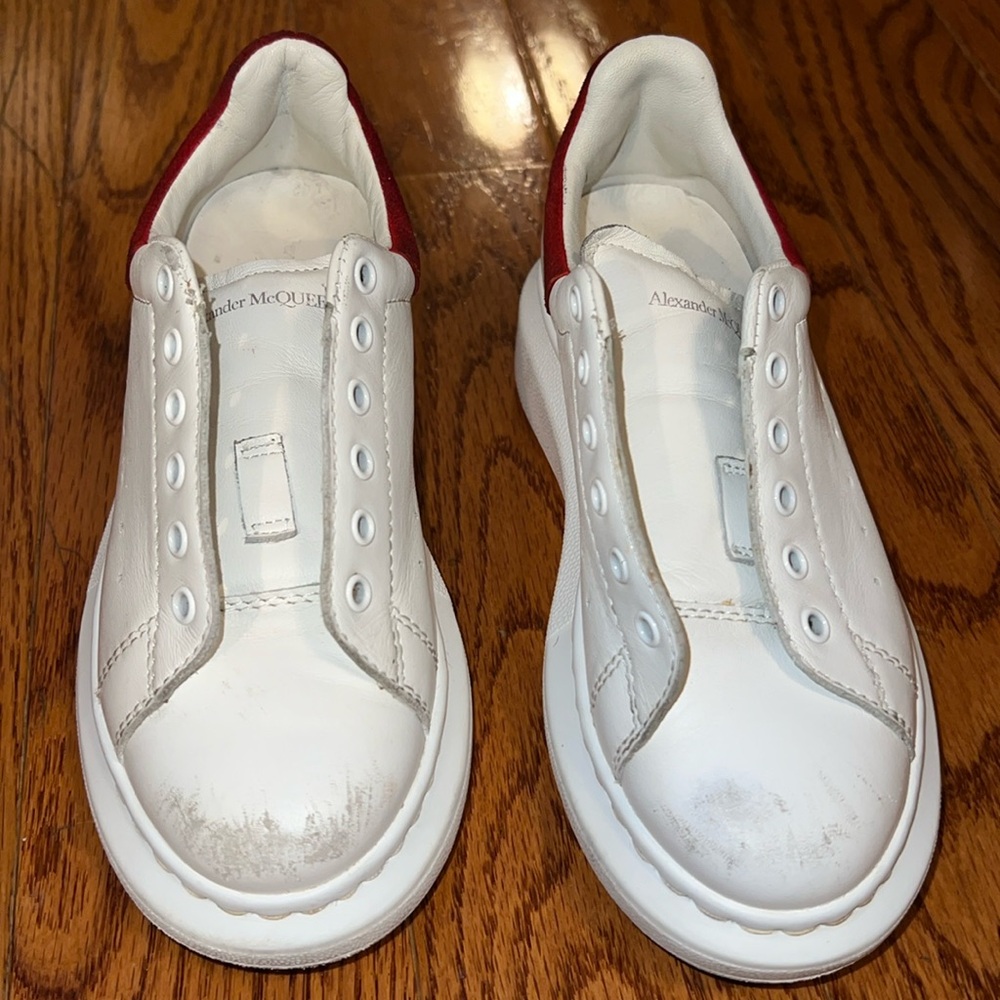 Used red and white big kids Alexander McQueens size 29